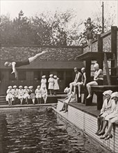 Rowntree factory workers sit around swimming pool, Yearsley baths, York,  Yorkshire, 1933. Artist: Unknown