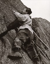 Boy climbing rock face, Outward Bound School, Eskdale, Cumbria,1950. Artist: Unknown