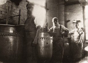 Men standing over boiling vats, Rowntree Cocoa Works, York, Yorkshire, 1900. Artist: Unknown