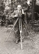 A photographer stands with his camera, County Industries, York, Yorkshire, 1943. Artist: Unknown