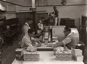 Men wrapping Rowntree's Fruit Gums and packing into boxes, Rowntree factory, York, Yorkshire, 1955. Artist: Unknown