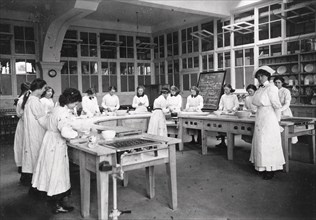 Girls domestic class, Rowntree?s factory, York, Yorkshire, 1913. Artist: Unknown