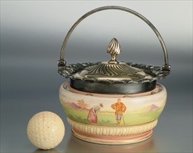 Biscuit barrel with golfing theme, Wood and Wood, c1893. Artist: Unknown