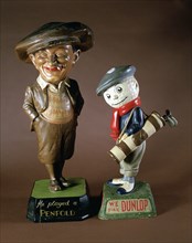 Penfold and Dunlop golfing figurines, c1920s. Artist: Unknown