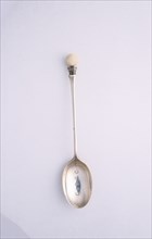 Silver spoon with golf ball motif, c1910. Artist: Unknown