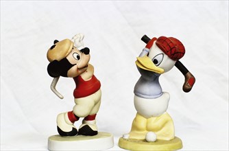 Hand-painted golfing figures of Mickey Mouse and Donald Duck, c1930s. Artist: Unknown