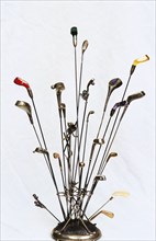 Golfing hatpins and pin holder. Artist: Unknown