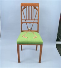 Walnut dining chair incorporating golf clubs and a golf ball, 1920s. Artist: Unknown