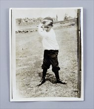American golfer Bobby Jones playing as a young child, c1909. Artist: Unknown
