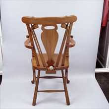 Oak chair carved with a golfing theme, 1920s. Artist: Unknown