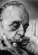 Larry Adler (1914-2001), Musician, playing his harmonica, 1992. Artist: Unknown
