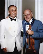 Yehudi Menuhin, American violinist, and Dov Seltzer, Romanian composer, 1992. Artist: Sidney Harris