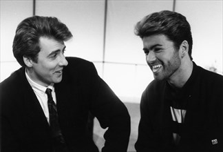 George Michael, British pop singer, and Jonathan Ross, British comedian and TV personality. Artist: Unknown