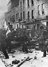 Police dismantle an anti-Fascist barricade, East London, 4th October 1936. Artist: Unknown