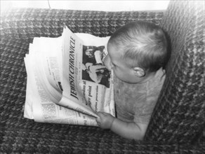 Baby Alex Feldman reading the Jewish Chronicle, 1968. Artist: Unknown
