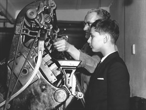 David Reiss inspects a linotype machine at the Jewish Chronicle, London, 1960. Artist: EH Emanuel