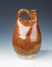 Brown glazed bottle of leather bag shape, Liao dynasty, China, 11th century. Artist: Unknown