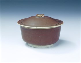 Ding persimmon red glazed covered bowl with white glazed interior, Jin dynasty, China, 12th century. Artist: Unknown