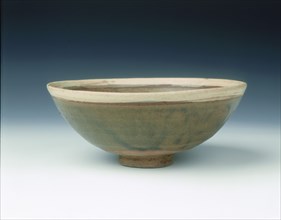 White rimmed celadon bowl with moulded peony scrolls, Jin dynasty, China, 13th century. Artist: Unknown