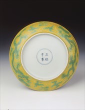Yellow saucer with dragons in green enamel, Zhengde period, Ming dynasty, China, 1506-1521. Artist: Unknown