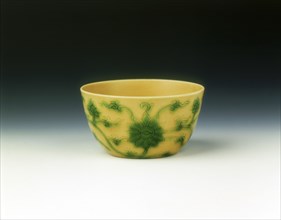 Yellow cup with lotus scrolls in green enamel, Yongzheng period, Qing dynasty, China, 1723-1735. Artist: Unknown