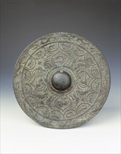 Bronze mirror with dragon and phoenix design, early Six Dynasties period, China, mid 3rd century. Artist: Unknown