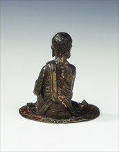 Gilt bronze statue of a lohan seated on a rush mat, late Ming dynasty, China, 1600-1644. Artist: Unknown