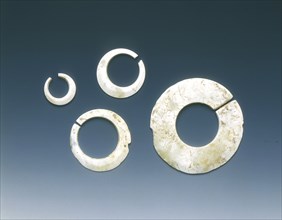Four altered jade asymmetrical slit-discs, Neolithic, Liangzhu culture, China, c3400-2200 BC. Artist: Unknown