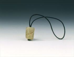 Jade bead with spiralling decoration, Western Zhou dynasty, China, c1100-771 BC. Artist: Unknown