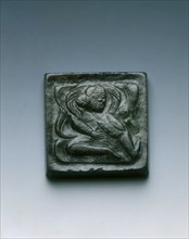 Mottled black jade square belt plaque with drummer in relief, Tang dynasty, China, 618-907. Artist: Unknown
