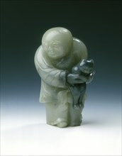 Jade chubby boy holding a black cat, early Ming dynasty or earlier, China, c1300-1550. Artist: Unknown