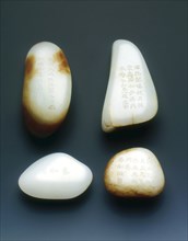 Set of four jade pebble paper weights, Qing dynasty, China, probably 18th century. Artist: Unknown