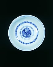 Blue and white 'hole in the bottom' bowl with hibiscus scroll, Ming dynasty, China, 15th century. Artist: Unknown