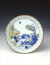 Polychrome saucer dish with cow and donkey, late Ming dynasty, Chongzhen period, China, 1630-1644. Artist: Unknown
