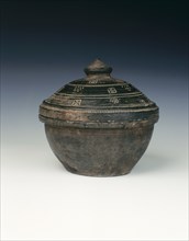 Shiny black circular pottery basin and cover, Han dynasty, China, 206 BC-220 AD. Artist: Unknown