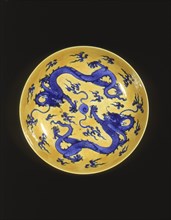 Blue and yellow dragon plate, Qing dynasty, China, 18th-19th century. Artist: Unknown