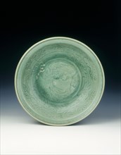Shichikan celadon dish with phoenix and peonies, Ming dynasty, China, 16th century. Artist: Unknown