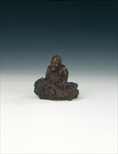 Wood carving of luohan and rock, Qing dynasty, China, 1644-1911. Artist: Unknown