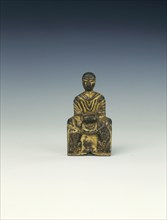 Gilt bronze Buddha seated on a lion-flanked throne, Six Dynasties period, China, 5th century AD. Artist: Unknown