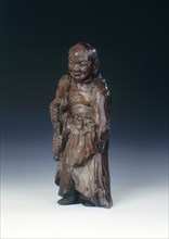Wooden Liu Hai figure with three-legged toad, early Qing dynasty, China, c18th century. Artist: Unknown