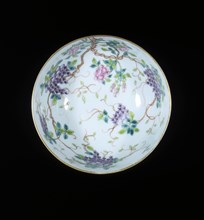 Bowl with ribboned swastikas above waves, Guangxu period, Qing dynasty, China, c1900. Artist: Unknown