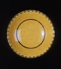 Yellow glazed dragon saucer, late Qing dynasty, China, 1870-1920. Artist: Unknown