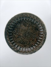 Brown Ding saucer with moulded floral decoration, Jin dynasty, China, late 12th-early 13th century. Artist: Unknown