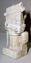 Roman terracotta lamp in the shape of a water-organ. Artist: Unknown