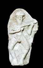 Babylonian terracotta figure of a male musician. Artist: Unknown