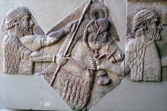 Assyrian relief of a man leading a horse and rider. Artist: Unknown