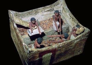 Egyptian model of workers in a grain store. Artist: Unknown