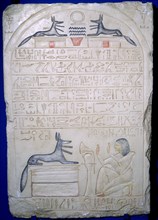 Egyptian elief stele of a man adoring Anubis. Artist: Unknown