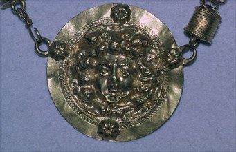 Gold Roman Gorgon's head pendant. Artist: Unknown