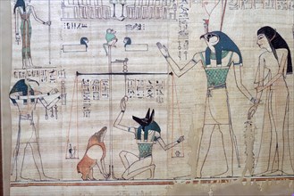 Weighing of the heart of the deceased against the feather of truth from the Egyptian Book of the Dea Artist: Unknown
